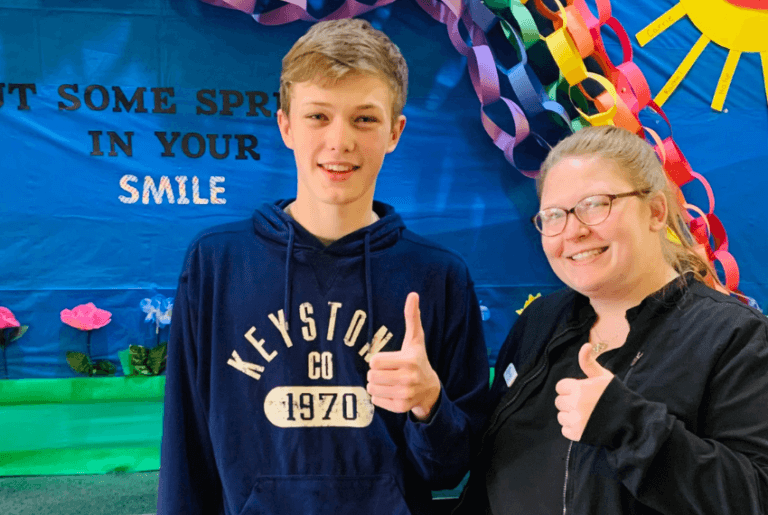 Happy patient and orthodontic assistant
